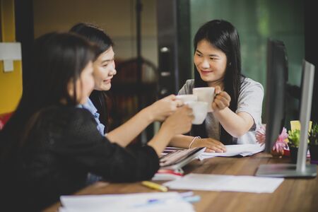 asian freelance relaxing lifestyle in home officeの写真素材