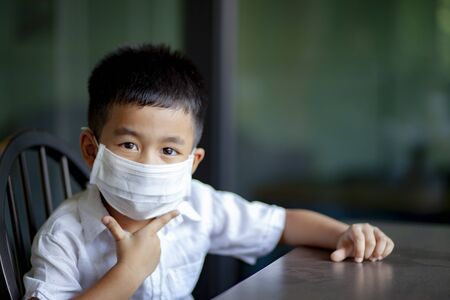 asian children wearing protection mask  quarantine at homeの写真素材