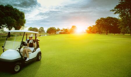 woman golfer drinking cool water in golf sport fieldの写真素材