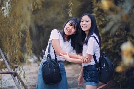 cheer asian teenager laughing with happiness faceの写真素材