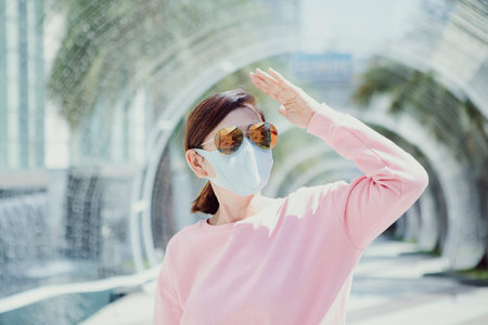 woman wearing protection face mask standing outdoor
