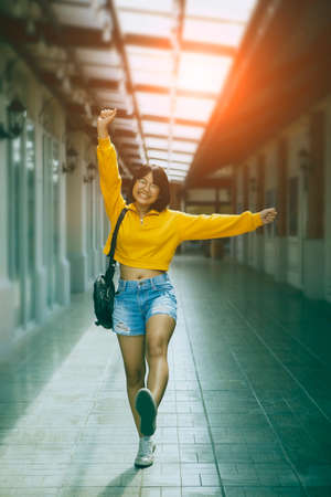 happiness asian girl walking at city street shopping