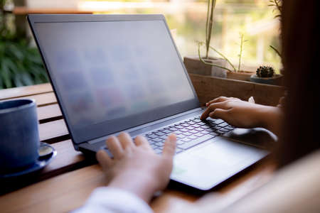 woman working on computer laptop at outdoor home living room