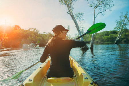 woman kayaking in fresh water lagoon at rayong province eastern of thailandの写真素材