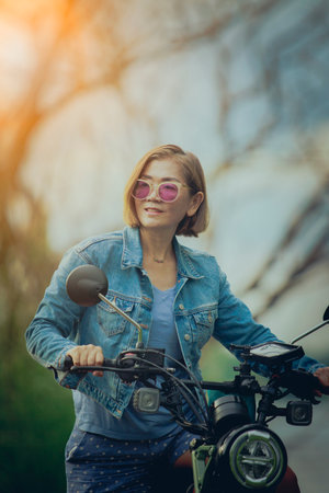 pretty woman riding sport motorcycle on track