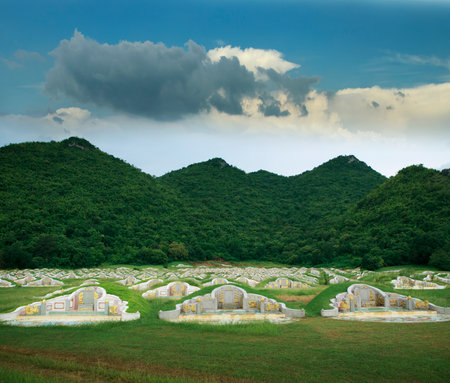 landscape of chinese mausoleum infront of green mountainの写真素材