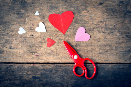 Valentine heart paper and scissors on wooden backgroundの写真素材