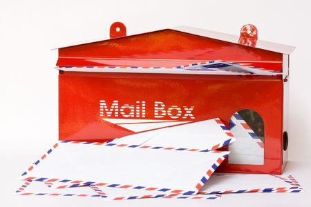white envelope in red mail boxの写真素材