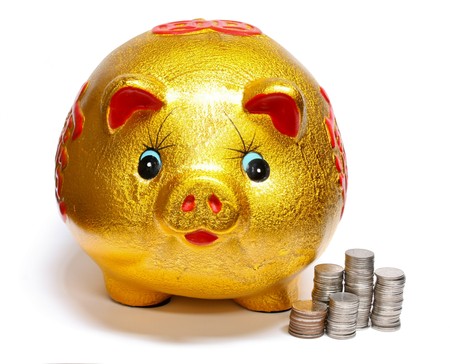 gold piggy bank for savingsの写真素材