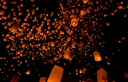 many lamp float in sky at nightの写真素材