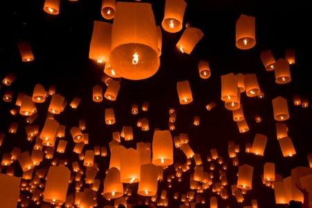 many lamp float in sky at nightの写真素材