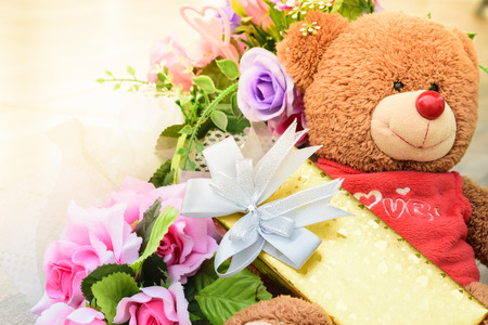 Golden gift boxes from bear with color effect for anniversary celebrationの写真素材