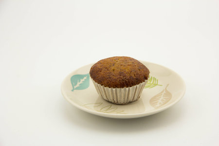 Banana cub cake on dish, brown and white background, fresh and sweet,  snack and foodの写真素材