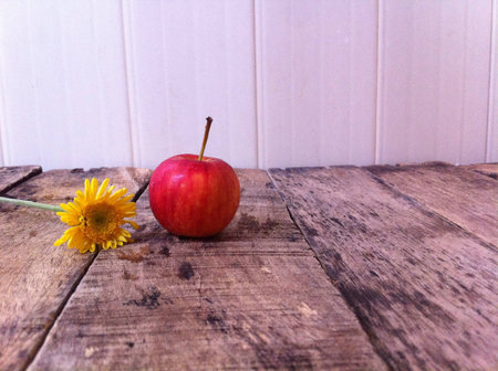 Apples and flowers on the woodenの素材
