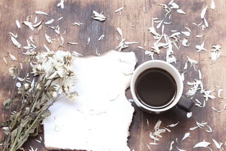 Cup of coffee on the wooden backgroundの写真素材