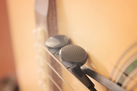 Black earphone on the guitar,vintage retroの写真素材