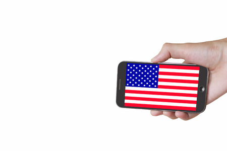 Man hand holding mobile smart phone with United States flag on the white backgroundの写真素材