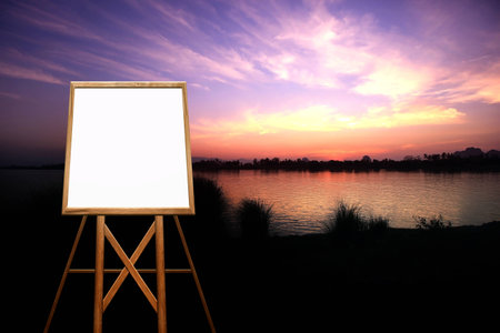 wooden draw board with sunset on the river backgroundの写真素材