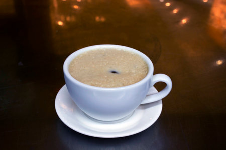Cup of coffee in coffee shop,vintage effect blur styleの写真素材