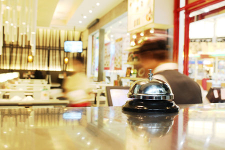 Service bell at the restaurant with bokeh blur backgroundの写真素材