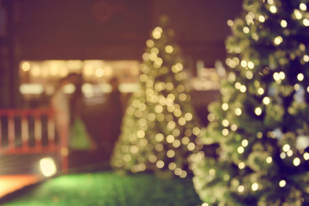 rustic wood table in front of christmas light night,abstract circular bokeh backgroundの写真素材