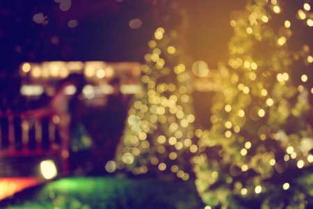 rustic wood table in front of christmas light night,abstract circular bokeh backgroundの写真素材
