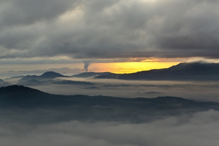 A sea of mist covering mountains during sunrise from a top of Khohong peak, near Hatyai city, Songkhla province, Thailand の写真素材