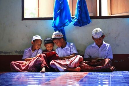 Krabi, Thailand - OCTOBER 29, 2012 : A small group of Muslim boys attend religion school session to read Koran in a local mosque. のeditorial素材