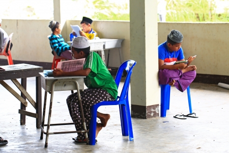 Krabi, Thailand - OCTOBER 29, 2012 : A small group of Muslim boys attend religion school session to read Koran in a local mosque. のeditorial素材