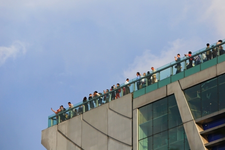 HONG KONG - JULY 19 : Tourists visit the Peak Tower on July 19, 2012 in Hong Kong. The Peak is the most popular attraction in Hong Kong, provides magnificent view of the city.のeditorial素材
