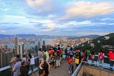 HONG KONG - JULY 19 : Tourists visit the Peak Tower on July 19, 2012 in Hong Kong. The Peak is the most popular attraction in Hong Kong, provides magnificent view of the city.のeditorial素材