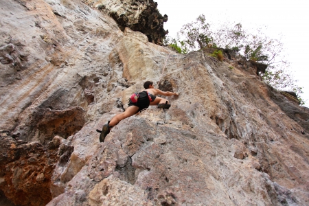 KRABI, THAILAND - JANUARY 25 : Unidentified rock climber during a climbing session on January 25, 2011 in Krabi, Thailand. Rock climbing in Krabi becomes popular over recent years.のeditorial素材
