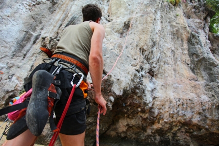 KRABI, THAILAND - JANUARY 25 : Unidentified rock climber during a climbing session on January 25, 2011 in Krabi, Thailand. Rock climbing in Krabi becomes popular over recent years.のeditorial素材