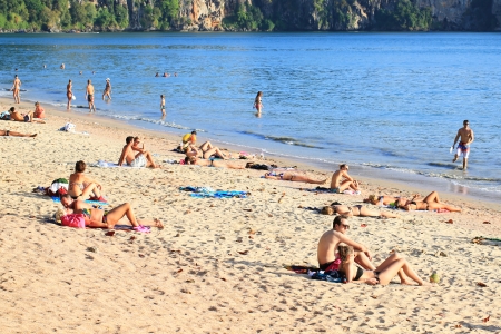 KRABI, THAILAND - FEBRUARY 5: Tourists on Ao Nang beach in summer on February 5, 2013 in Krabi, Thailand. Ao Nang beach is a famous tourist destination in Krabi, Thailand. のeditorial素材