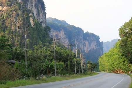Asphalt road with mountain scenery, Krabi, Thailandの写真素材
