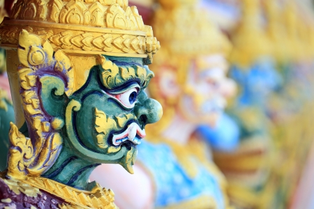 Guardian statues at temple in Thailand の写真素材