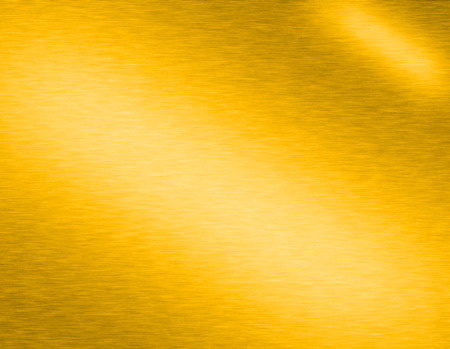 Gold metal brushed background or texture of brushed steel plate with reflections Iron plate and shinyの写真素材