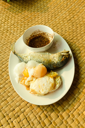Fried mackerel and fried eggs and boiled eegs is high protein foodsの写真素材