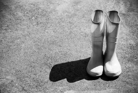 One couple of white Rubber bootsの写真素材