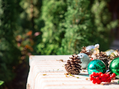Christmas ball and pine cones decoration on table for party, selective focusの写真素材