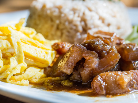 Rice Mixed with Shrimp paste in white plate on wood tableの写真素材
