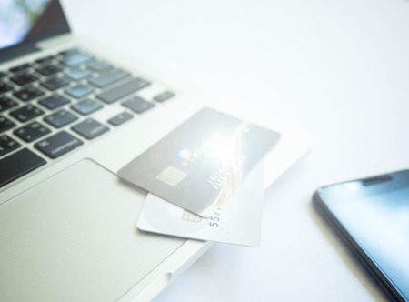 Notebook, credit card, mobile phone and wallet on white backgroundの写真素材