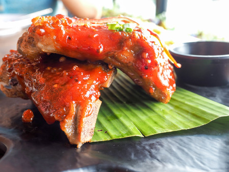 roast pork spareribs with barbecue sauce serve with fried vegetableの写真素材