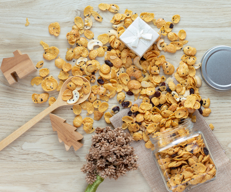 Cornflakes caramel in glass bottle on wood background.の写真素材