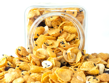 Cornflakes caramel in glass bottle white background. Dessert.の写真素材