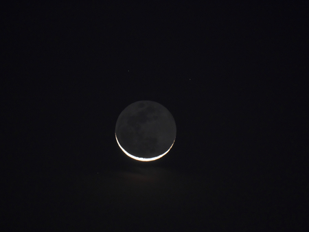 Earthshine of a crescent moon (Tokyo, Japan-October 29, 2016)の写真素材