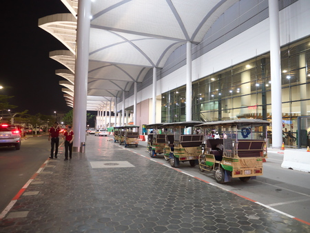Phnom Penh, Cambodia-December 24, 2017: Taxis and tuktuks queue at a taxi stand of Phnom Penh international airport.のeditorial素材