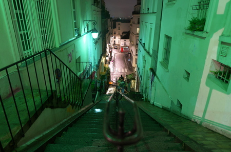 Paris, France-January 18, 2018: Wet long stone steps of Rue Drevet or Drevet street before sunrise in Montmartre, Parisのeditorial素材