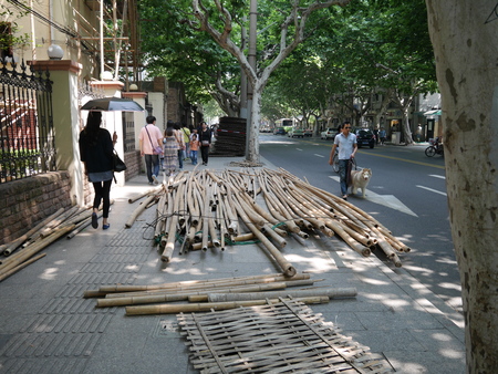 Shanghai, China-June 6, 2015: Bamboos for scaffolding laid on Wukang Road, old Shanghai French Concession area.のeditorial素材