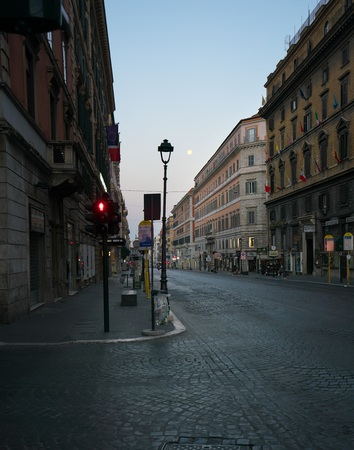 Rome, Italy-July 29, 2018: The full moon is going to set at vacant Nazionale street in the early light, Romeのeditorial素材